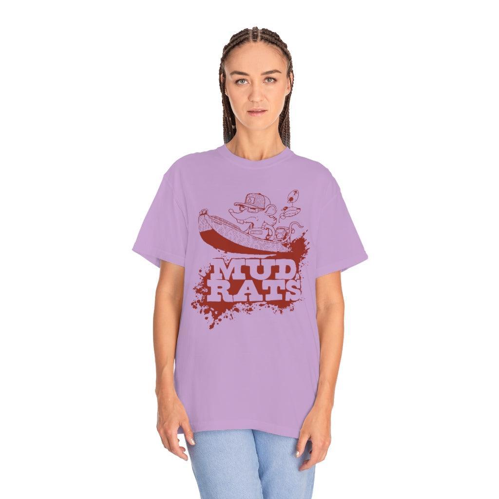 A woman modeling a lavender purple t-shirt with a red graphic of a muddy rat and the text 'MUD RATS'.