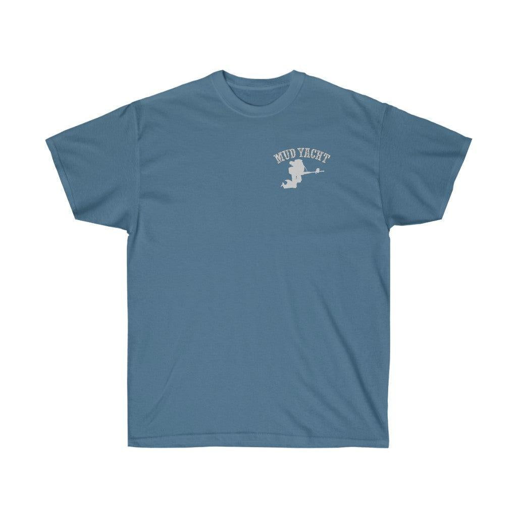 A slate blue crewneck t-shirt with a small white graphic on the left chest featuring the text 'MUD YACHT' and a silhouette of a person on a sailboat, displayed against a solid white background.