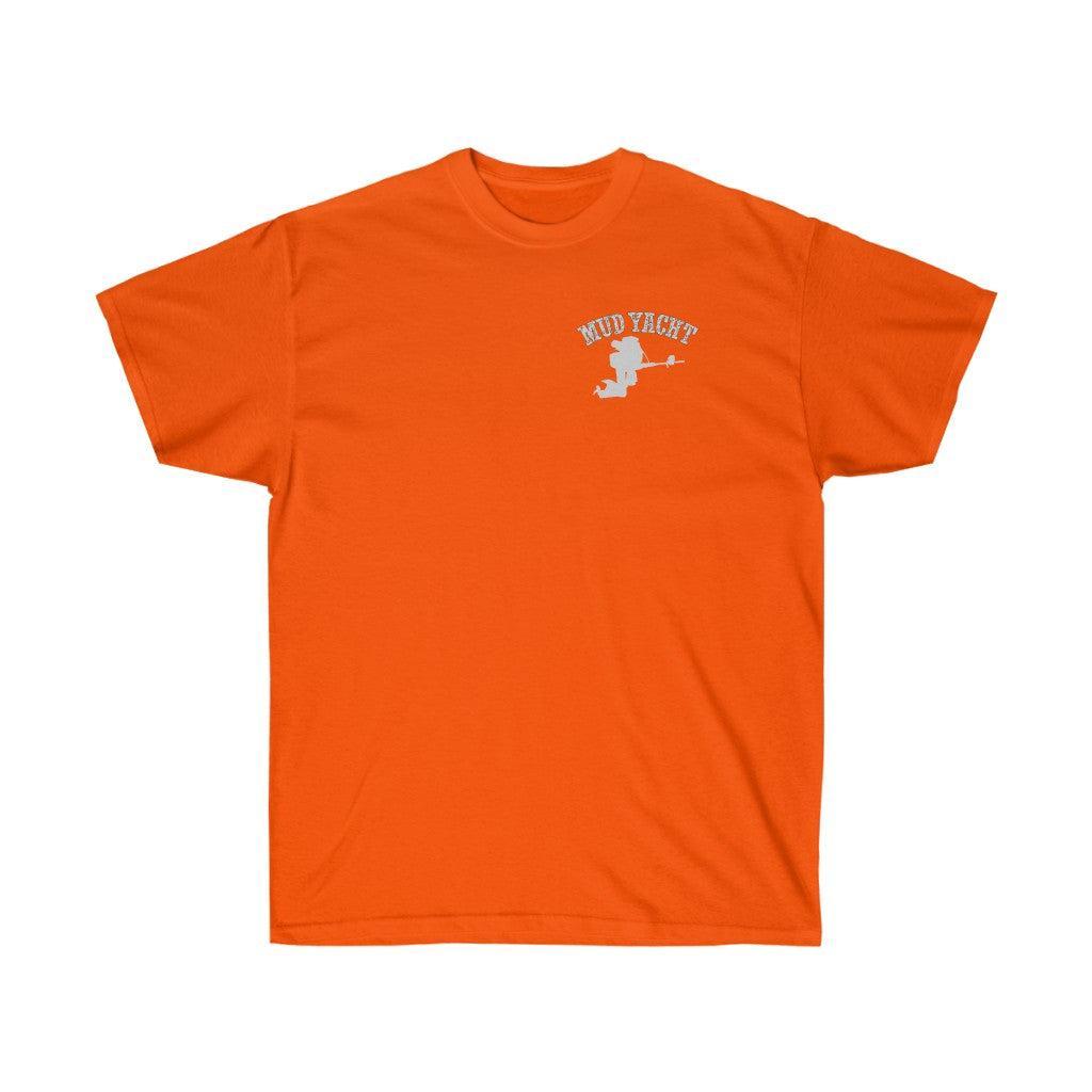 An orange short-sleeve crewneck t-shirt with a small white graphic on the left chest featuring the text 'MUD YACHT' and a silhouette of a person riding a motorcycle.