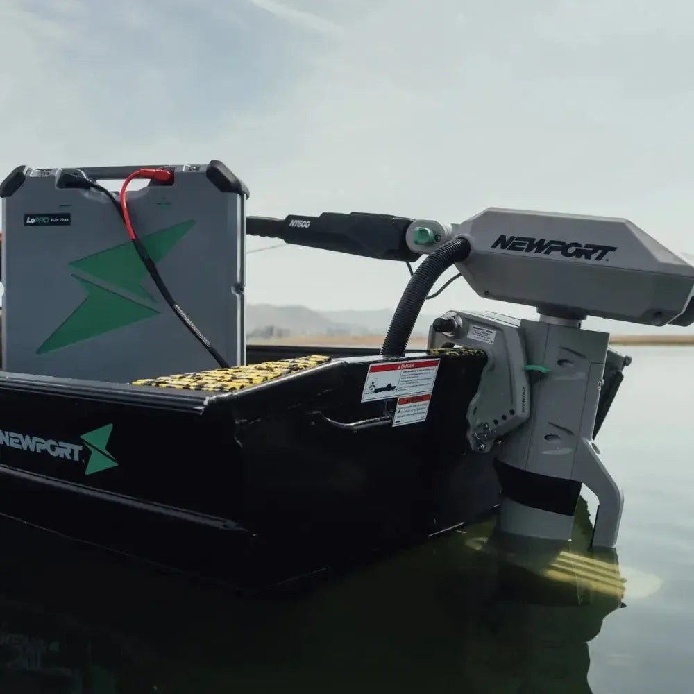 Newport NT600 6hp electric outboard motor mounted on a black jon boat with a gray LoPro battery.