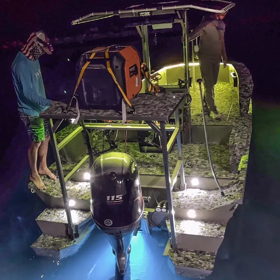Plashlight RGBW flexible light strips illuminating a camouflage boat and water at night.
