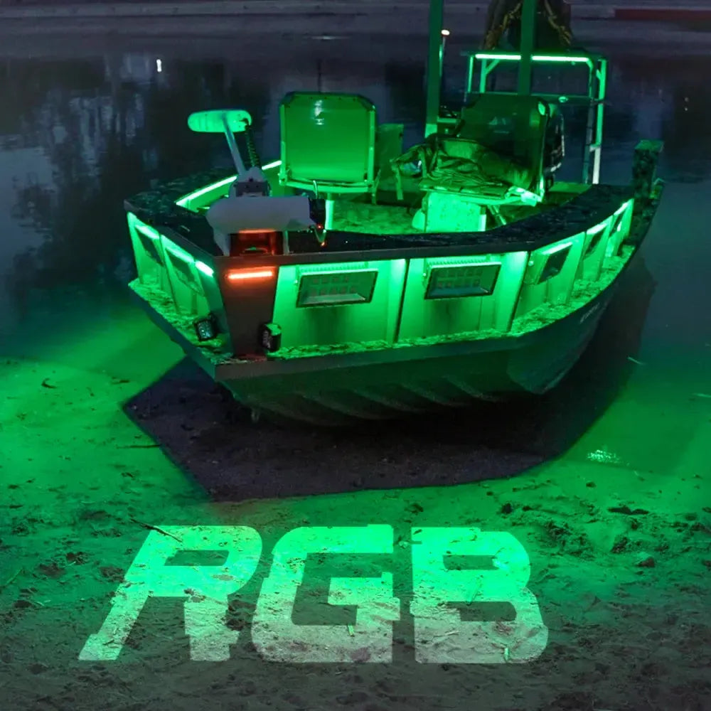 Green Plashlight RGBW flexible light strip illuminating a boat at night, with "RGB" projected on the ground.