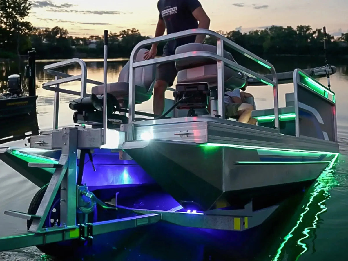 RGBW color-changing waterproof flexible light strip illuminating a pontoon boat at dusk.