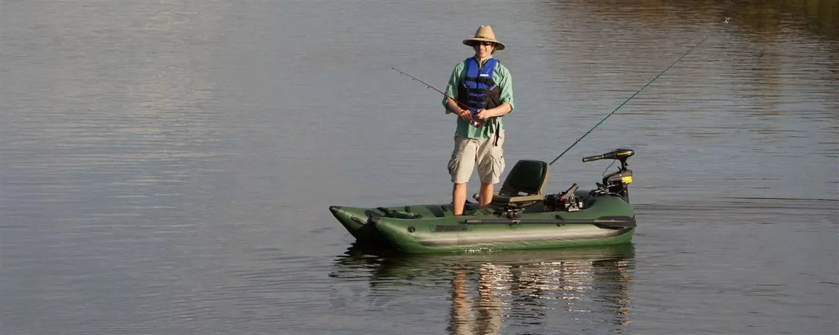 Man fishing from a Hunter Green Sea Eagle 285 Frameless Pontoon Boat with a trolling motor.