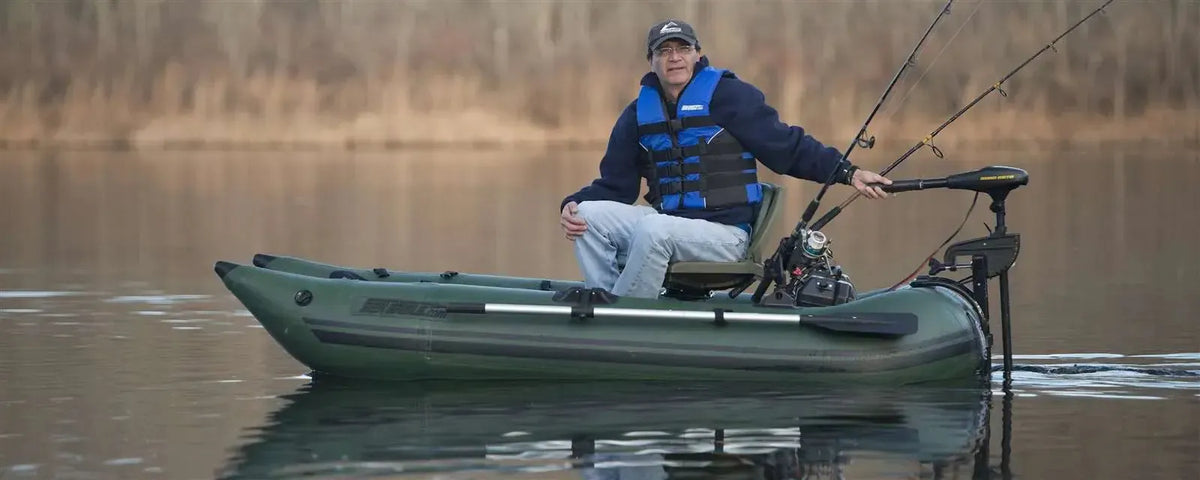 Man fishing from a Hunter Green Sea Eagle 285 frameless inflatable pontoon boat with a trolling motor.