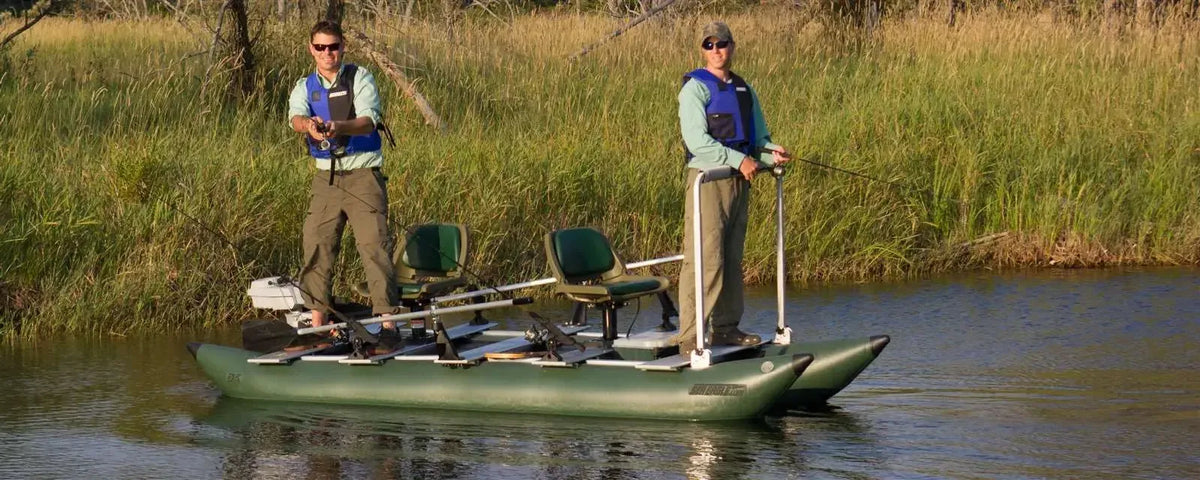 Two men fishing from a dark hunter green Sea Eagle 375fc FoldCat inflatable pontoon boat with Scotty rod holders.