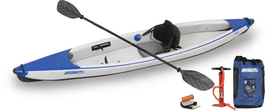 White and blue Sea Eagle 393rl RazorLite inflatable kayak with paddle, pump, and carry bag.