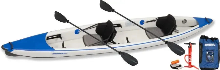 White and blue Sea Eagle 473rl inflatable tandem kayak with paddles, pump, and carry bag.