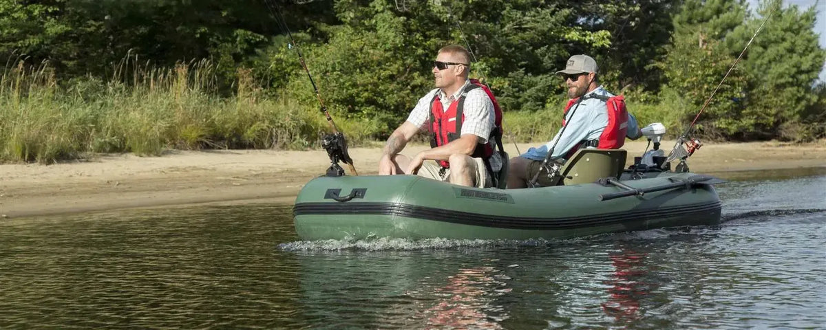 Two men fishing in a Hunter Green Sea Eagle Stealth Stalker 10 inflatable boat on calm water.