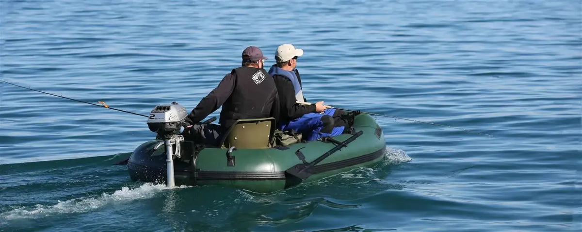 Two men fishing from a Hunter Green Sea Eagle Stealth Stalker 10 inflatable boat with an outboard motor.