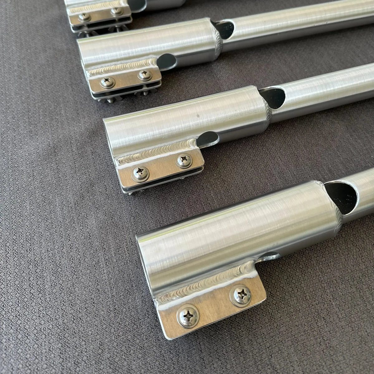Silver aluminum X-LONG tiller extension handles with precision welds and cut-out for motor kill switch.
