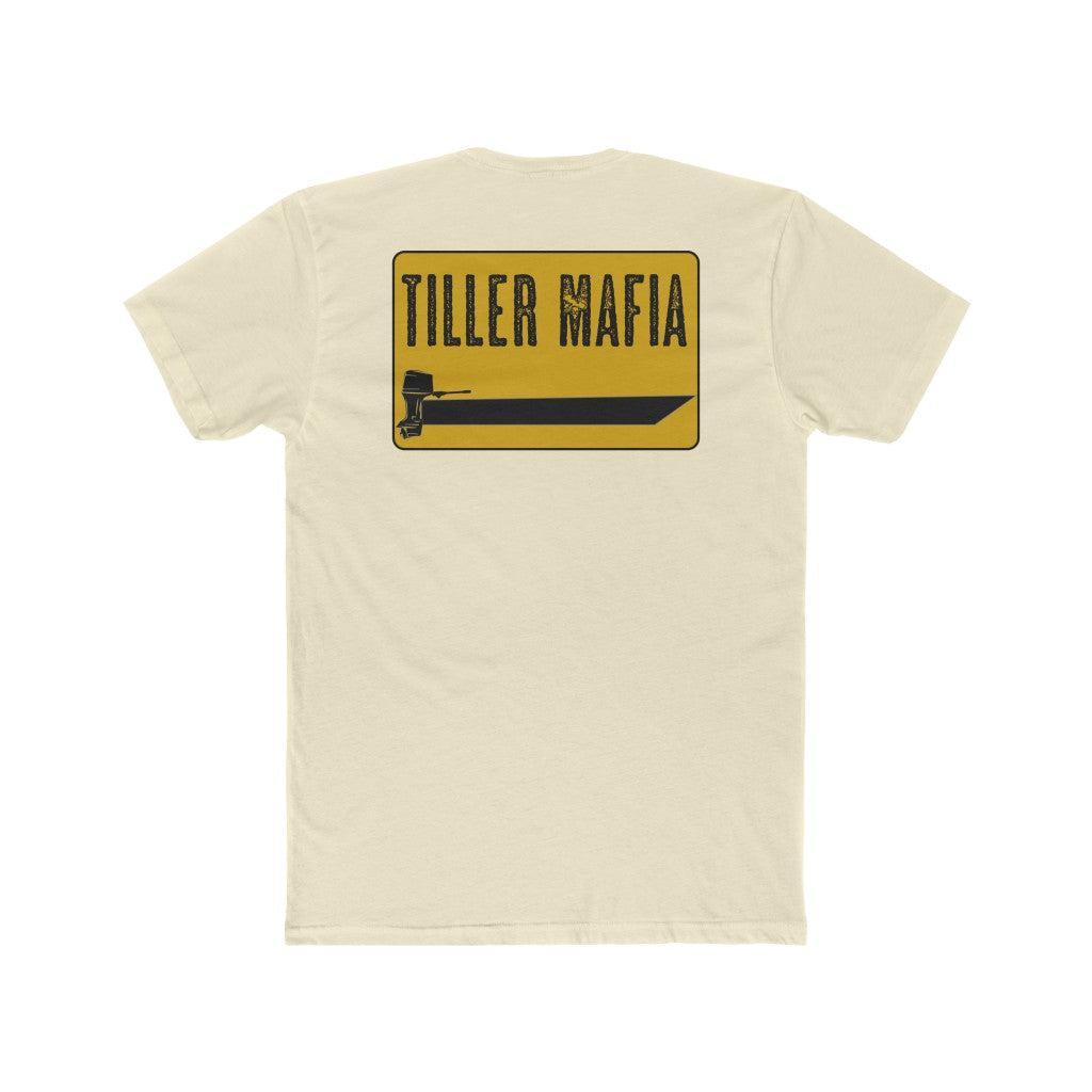 An off-white short-sleeve t-shirt shown from the back, featuring a yellow and black graphic print that reads 'TILLER MAFIA' above a large black blade silhouette.