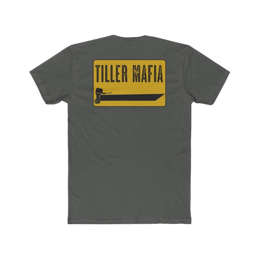 A dark gray short-sleeve t-shirt shown from the back, featuring a yellow rectangular graphic with the text 'TILLER MAFIA' in black and a black till tool illustration.