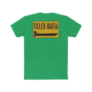 A green short-sleeve t-shirt shown from the back, featuring a yellow rectangular graphic with the text 'TILLER MAFIA' in black above a black tractor graphic.