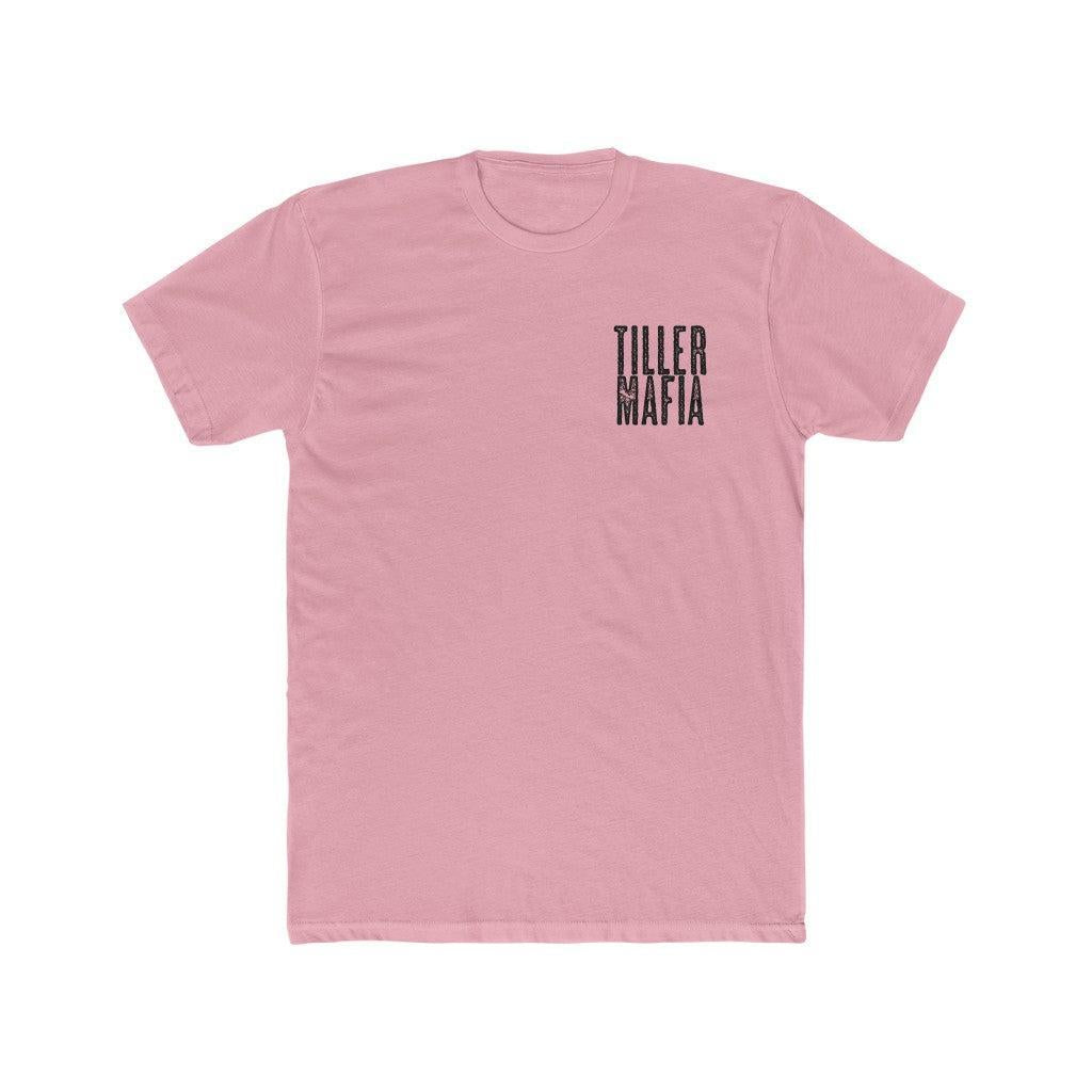 A light pink short-sleeve crewneck t-shirt with the words 'TILLER NAFIA' printed vertically in black on the left chest, displayed on a solid white background.