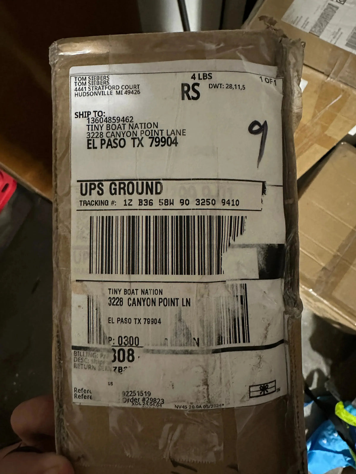 UPS shipping label on a package with shipping details.