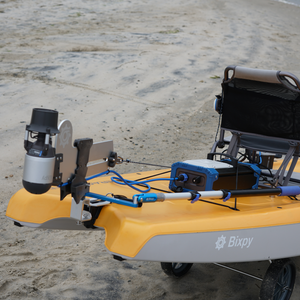 Yellow and gray device with a chair on a sandy surface, featuring the brand 'Bixpy'.