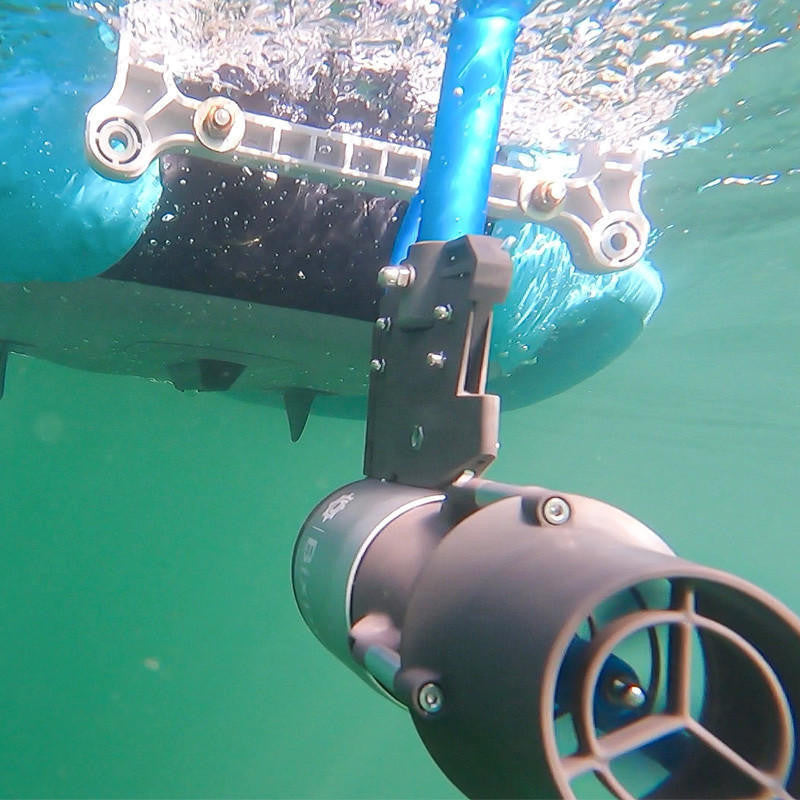 Underwater vehicle or drone with a camera lens submerged in water.