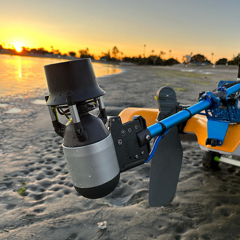 Close-up of a drone on a beach with sunset in the background