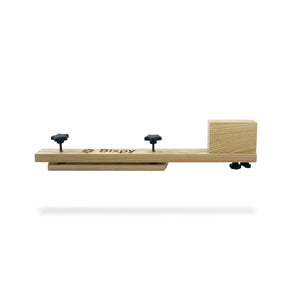 Wooden scooter with 'Bixpy' branding on a white background