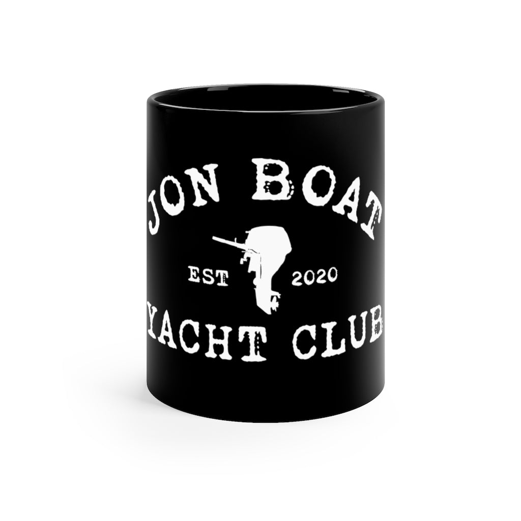A black ceramic mug with a white distressed graphic that reads 'JON BOAT YACHT CLUB' and 'EST 2020' with a boat outline, shown on a plain white background.