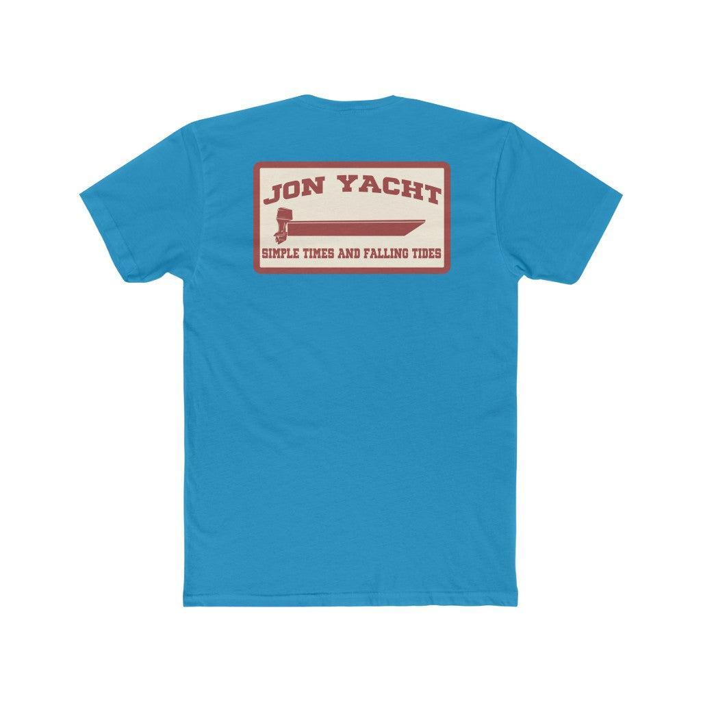A bright blue short-sleeve t-shirt shown from the back, featuring a rectangular graphic print with a cream background and red text reading 'JON YACHT' and 'SIMPLE TIDES AND FALLING TIDES'.