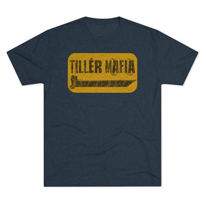 A navy blue heather crewneck t-shirt featuring a distressed yellow rectangular graphic on the chest with the text 'TILLER MAFIA' in black.
