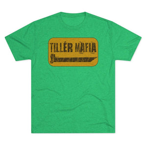 A green heather crewneck t-shirt featuring a distressed yellow rectangular graphic on the chest with the text 'TILLER MAFIA' and a small illustration.
