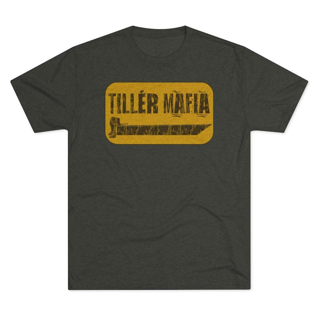 A dark heather gray t-shirt with a distressed yellow rectangular graphic on the chest that reads 'TILLER MAFIA' in black text.