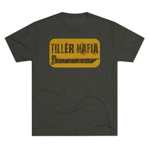 A dark heather gray t-shirt with a distressed yellow rectangular graphic on the chest that reads 'TILLER MAFIA' in black text.
