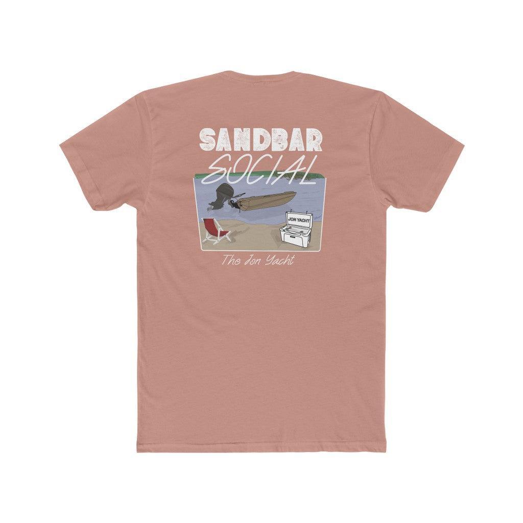 A dusty rose short-sleeve t-shirt shown from the back, featuring a graphic print with the text 'SANDBAR SOCIAL' and 'The Jon Yacht' above and below an illustration of a surfer on a beach.