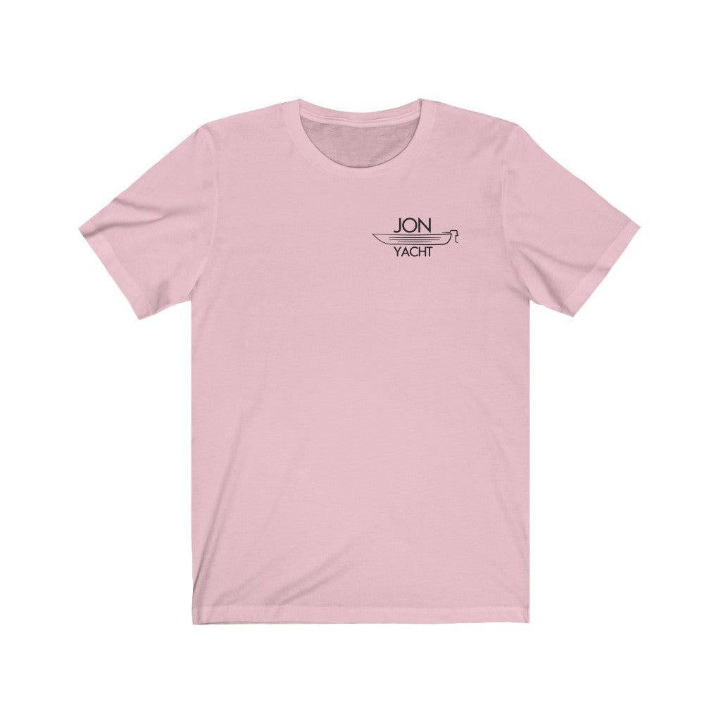 A light pink short-sleeve crewneck t-shirt with a small black graphic on the left chest reading 'JON YACHT' above a sailboat outline, displayed on a solid white background.