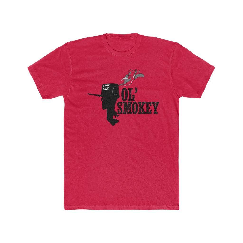 A red short-sleeve crewneck t-shirt featuring a black graphic of a silhouette wearing a cowboy hat with a smoking pipe, accompanied by the text 'OL' SMOKEY' and a small 'DARK SHOT' logo on the chest, displayed against a plain white background.