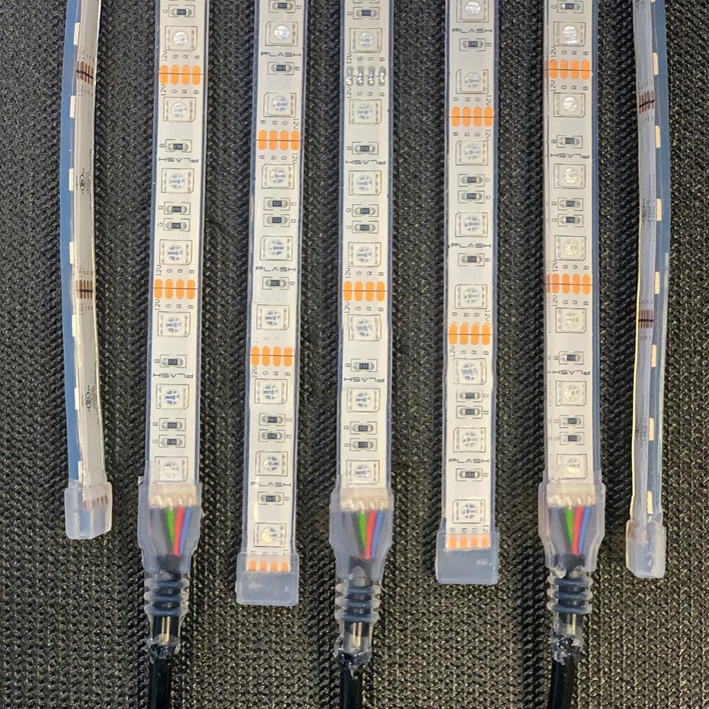 Five Plash LED light strips with clear protective casings and RJ45 connectors, laid out side-by-side on a dark textured background.