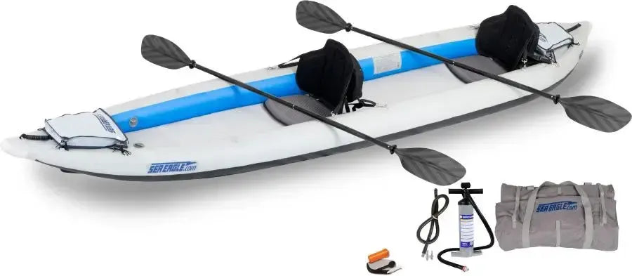 White and blue Sea Eagle 465ft FastTrack inflatable kayak with two paddles, pump, and carry bag.
