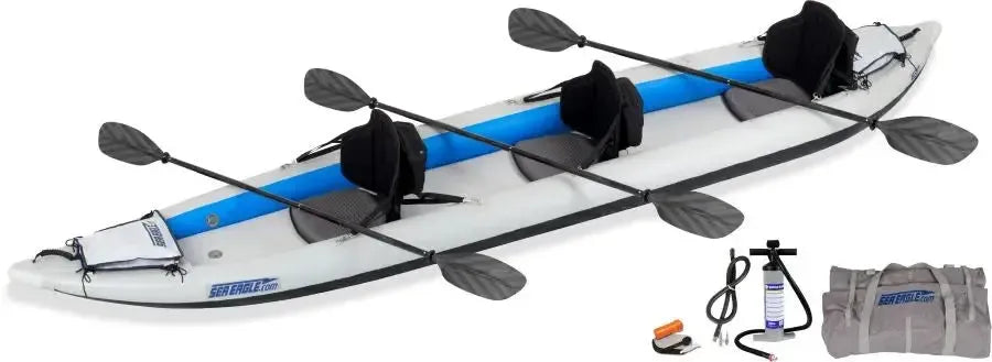 White and blue Sea Eagle 465ft FastTrack inflatable kayak with three seats, paddles, pump, and carry bag.