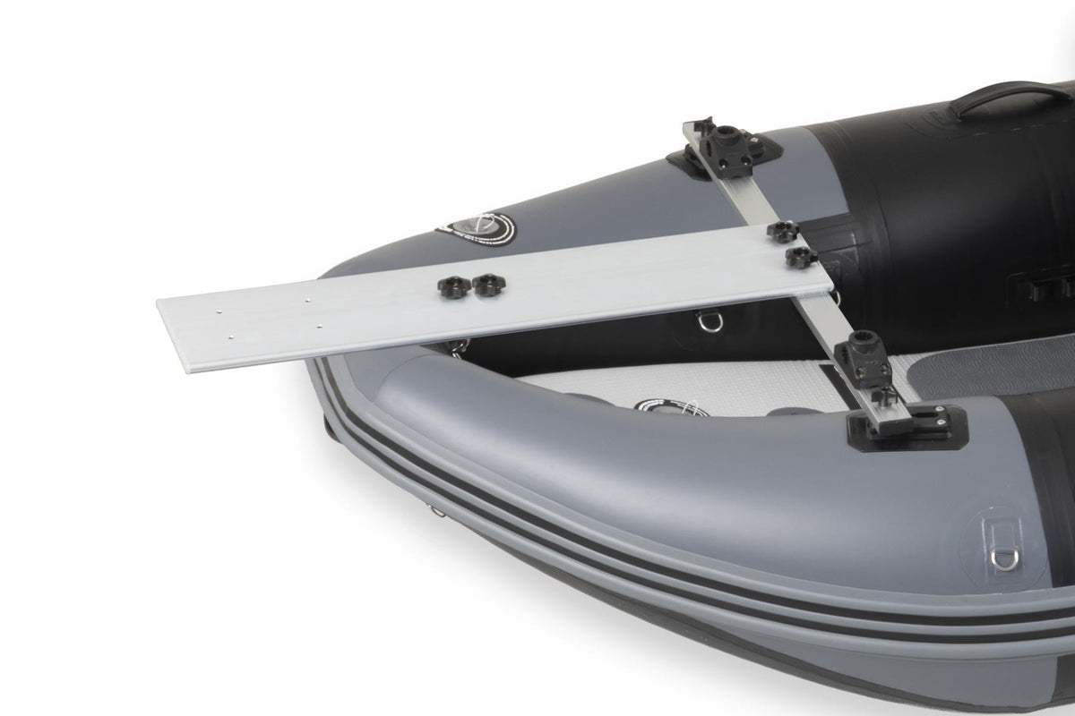 A close-up studio shot of a gray and black sea eagle nflatable boat with a white metal mounting bracket attached near the stern, on a white background.