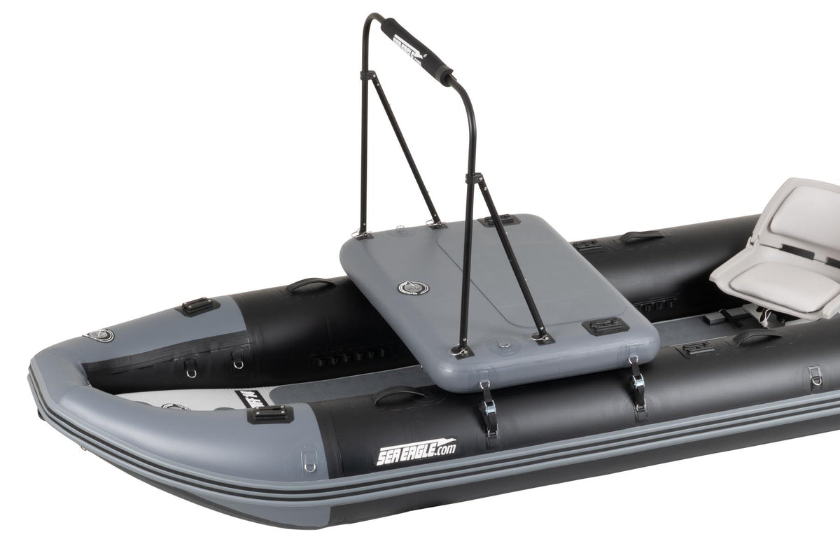 A gray and black sea eagle inflatable boat with a gray hatch cover, black support poles, and a white seat, shown on a plain white background.
