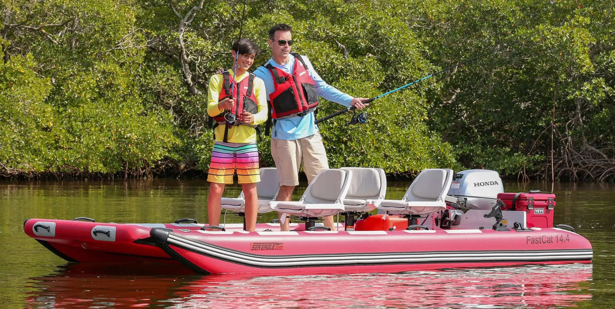 Red Sea Eagle FastCat14 inflatable catamaran with two people fishing, four seats, and a Honda motor.