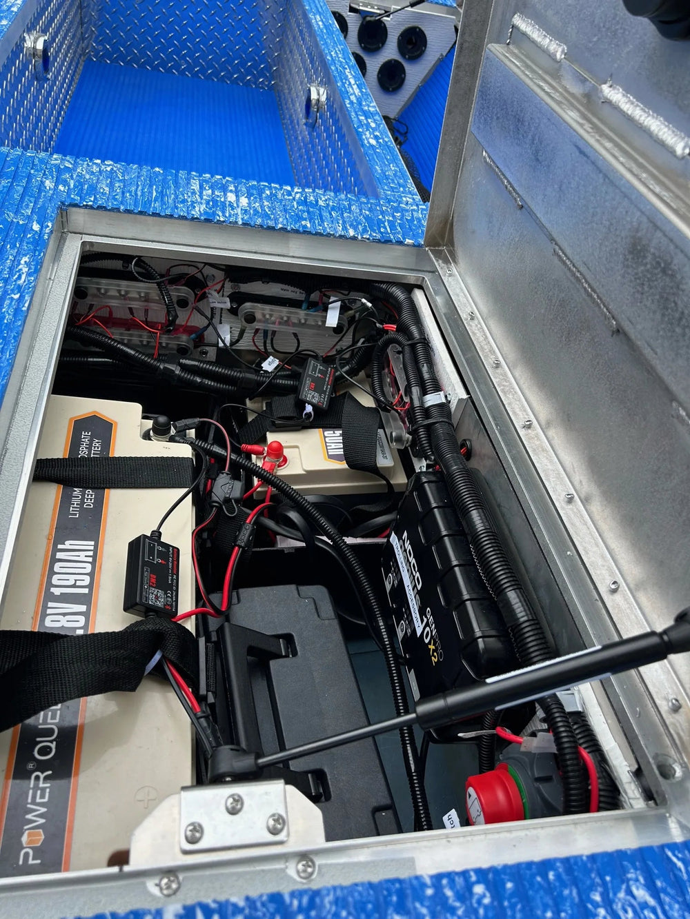 Aluminum Jon boat conversion with blue EVA foam flooring, Millennium seat, and trolling motor.