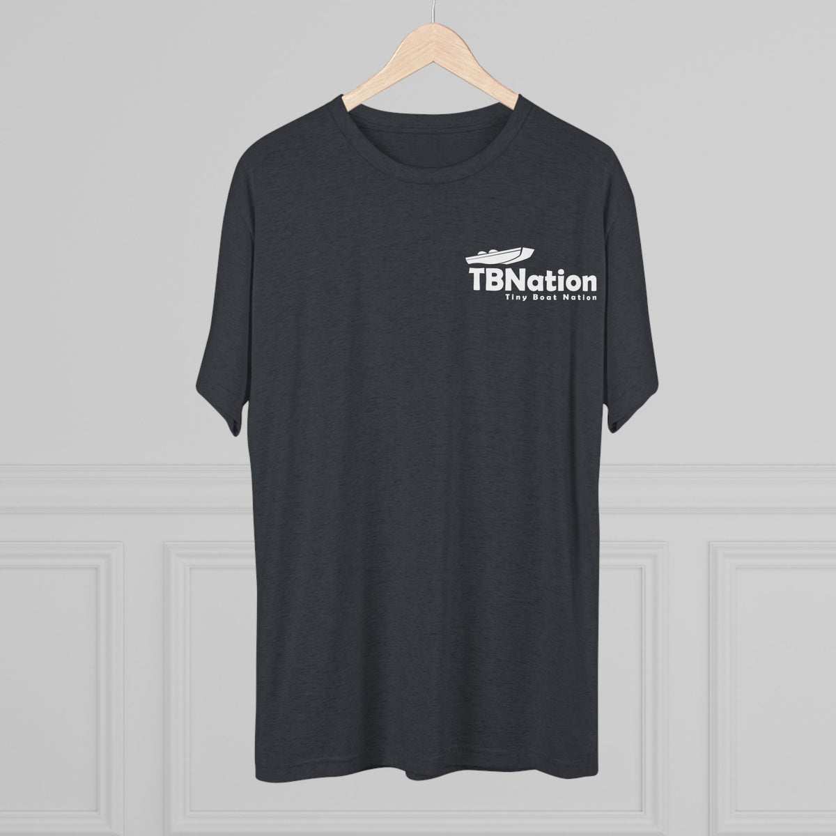 Black t-shirt with 'TBNation' logo on a hanger against a gray background