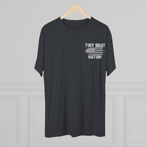 Black t-shirt with 'Tiny Boat Nation' text on a hanger against a gray background