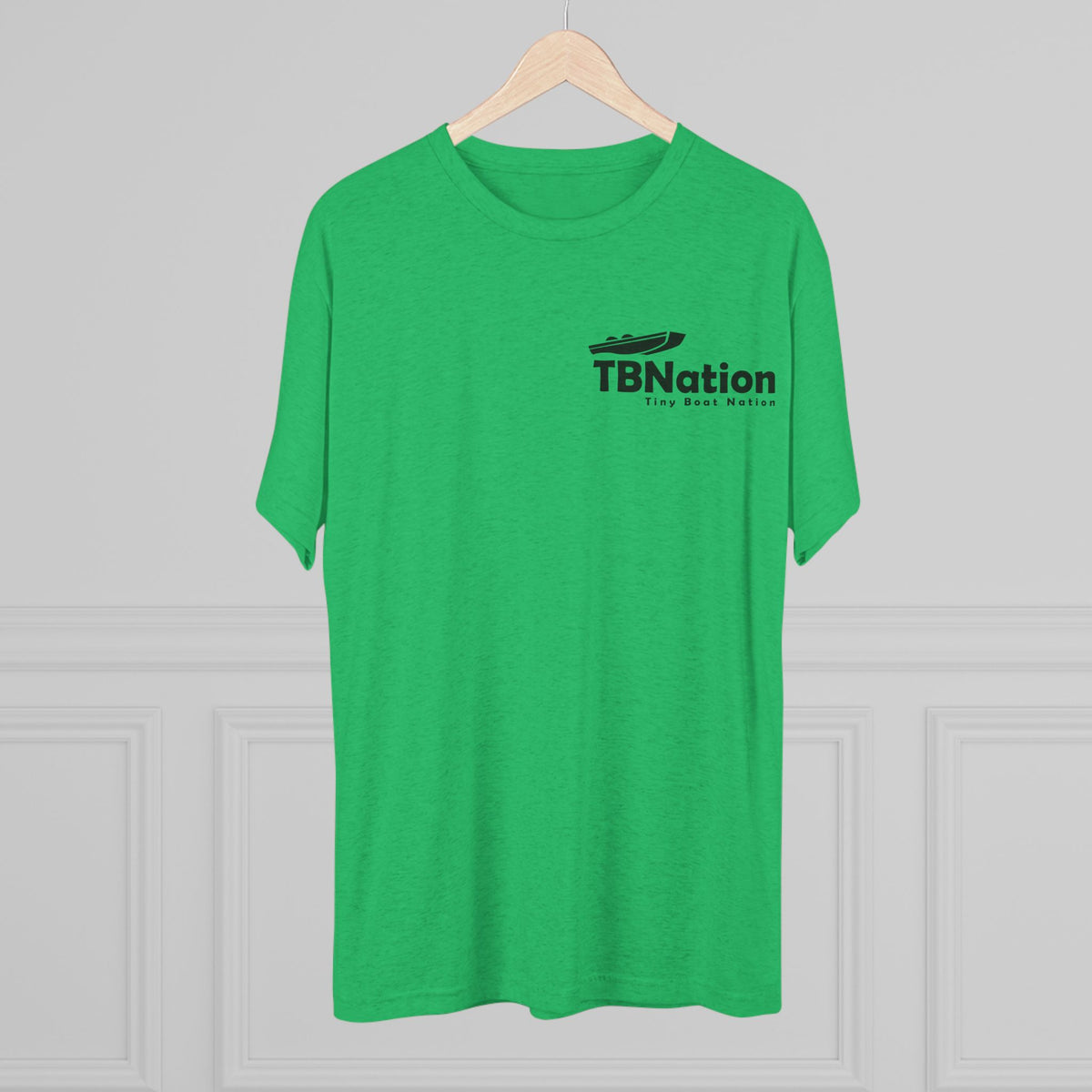 Green t-shirt with 'TBNation' logo on a wooden hanger against a gray background
