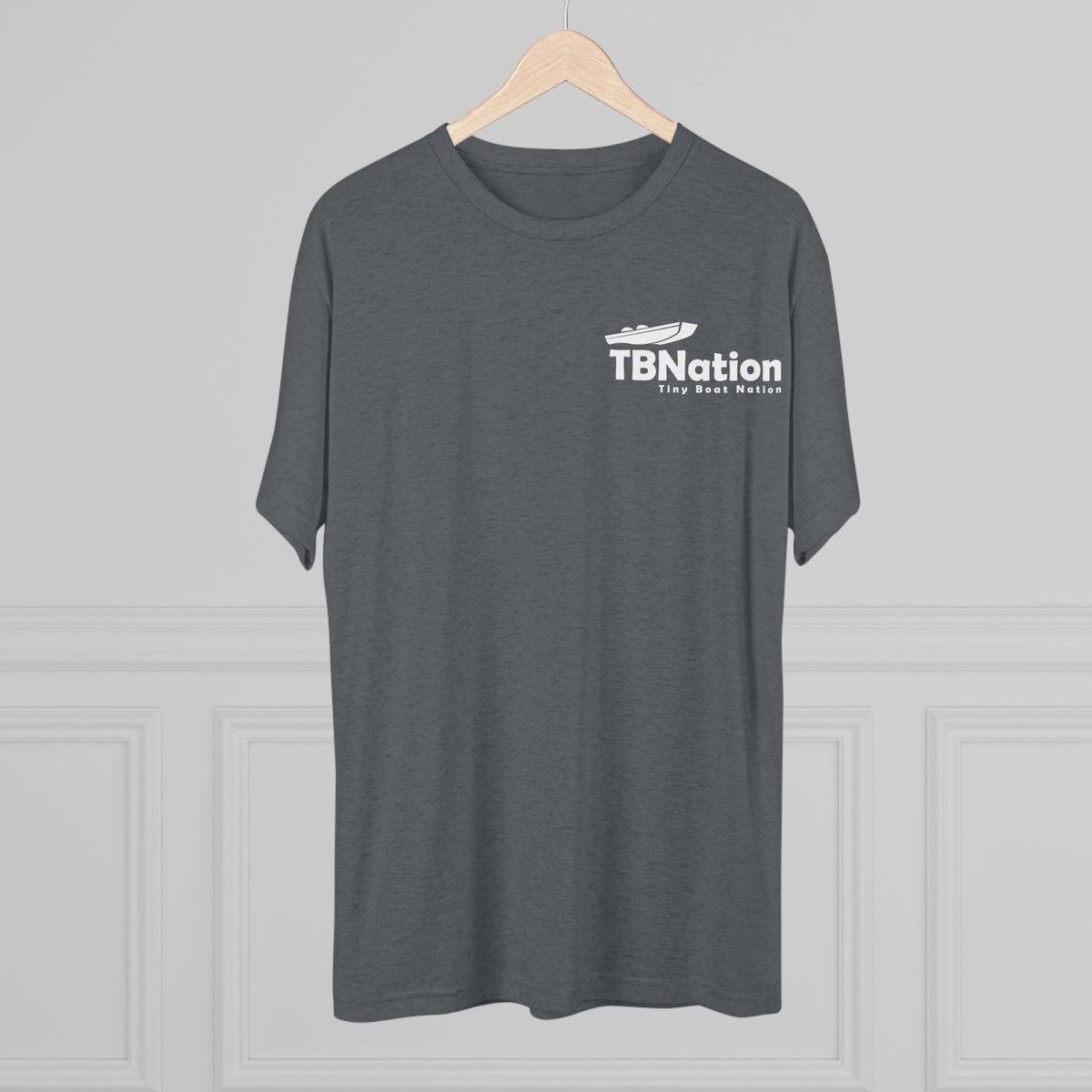 Gray t-shirt with 'TBNation' logo on a hanger against a gray background