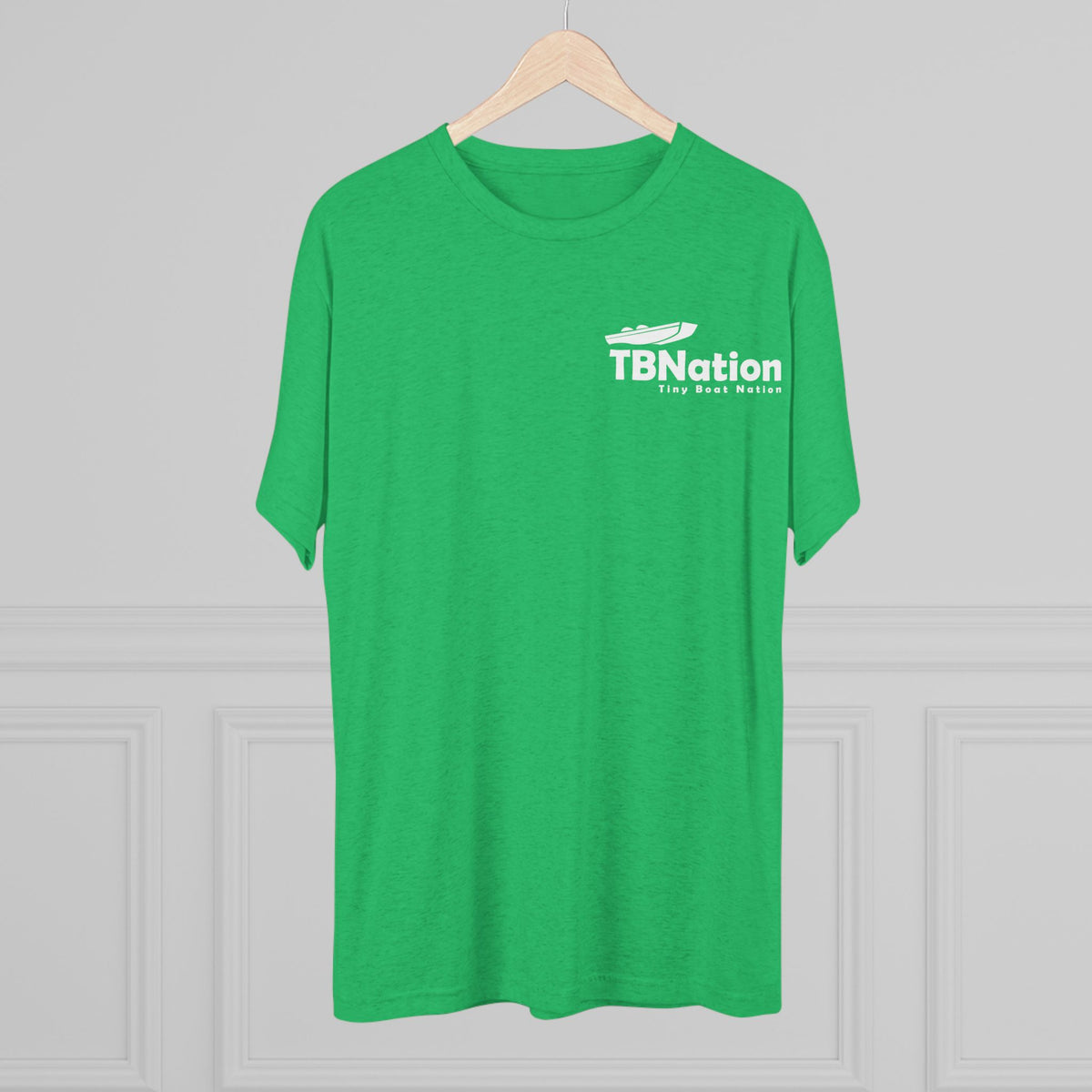 Green t-shirt with 'TBNation' logo on a hanger against a gray background