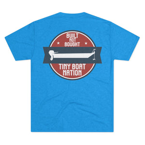 Blue t-shirt with a graphic design on the back featuring text and a boat illustration.