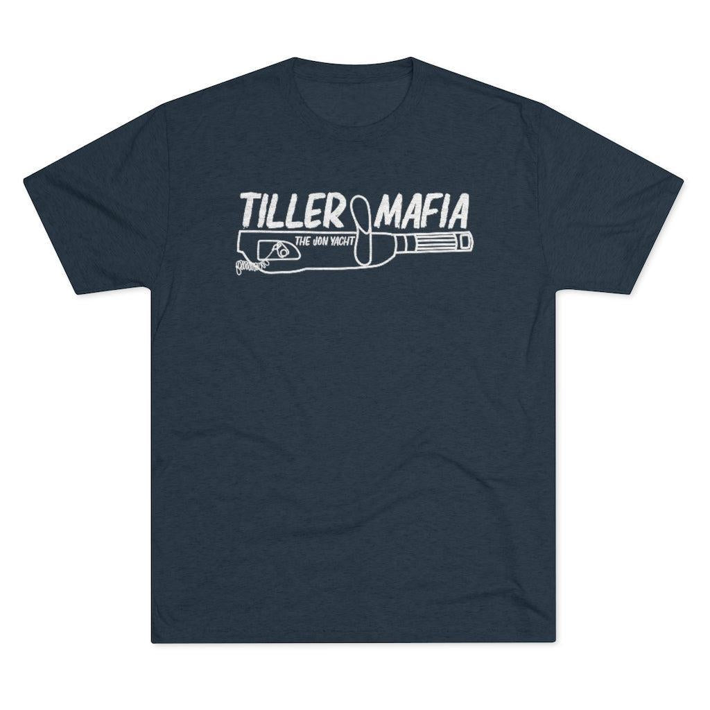 A navy blue short-sleeve crewneck t-shirt with a white graphic print on the chest reading 'TILLER MAFIA' above a rifle illustration, shown on a plain white background.