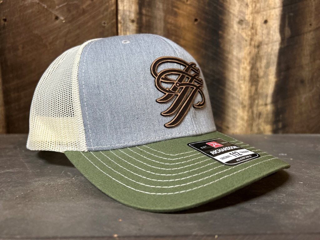Trucker hat with embroidered logo on a wooden surface