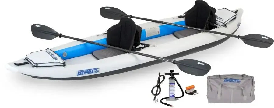White and blue Sea Eagle 385ft FastTrack inflatable kayak with two paddles, seats, pump, and carry bag.