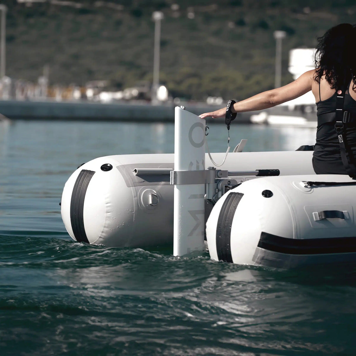 Remigo One 3hp electric outboard motor mounted on a white dinghy transom
